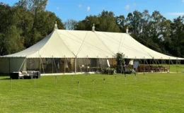 Marquee installed on grassed estate with protected lawn surface, preserving parkland during temporary event use