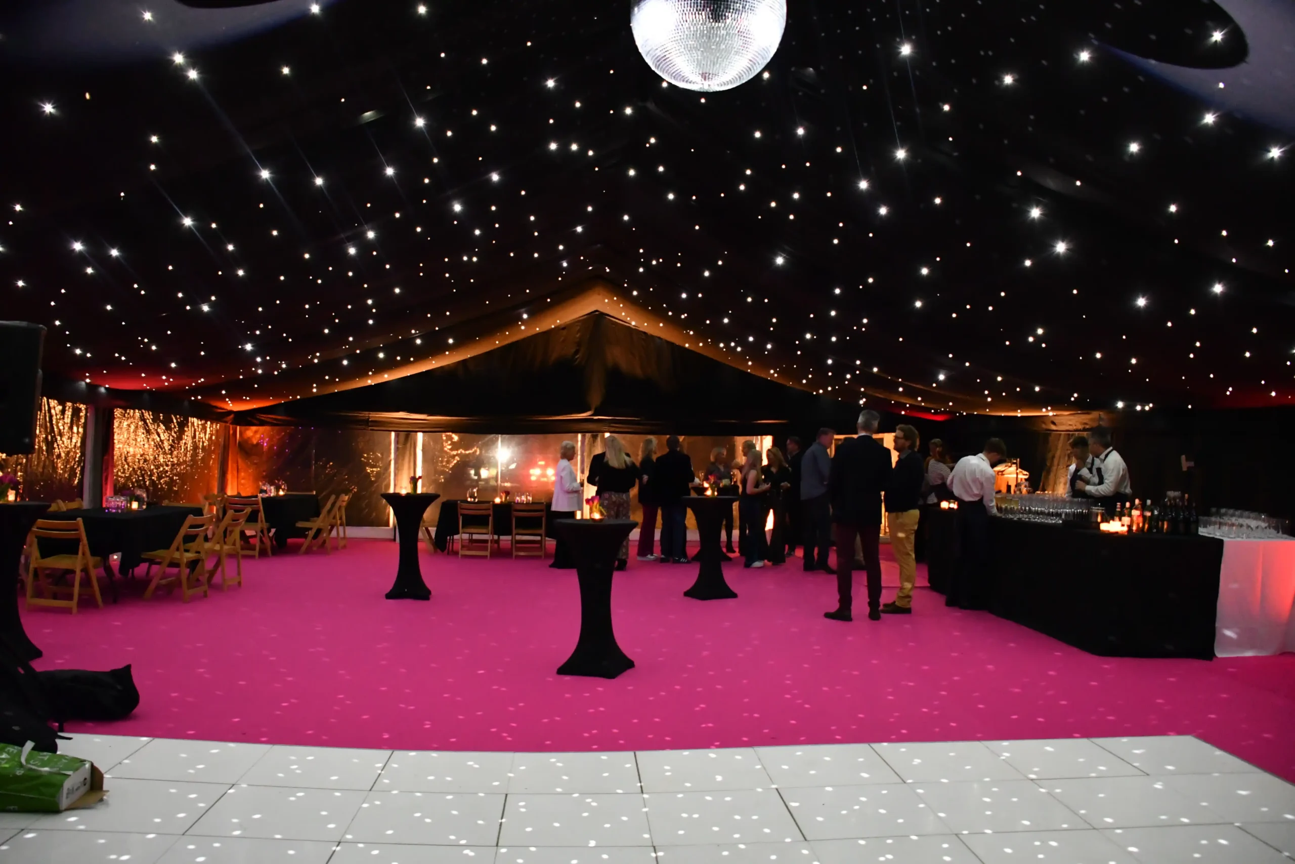 Garden party with pink carpet entrance and blackout marquee interior for a glamorous 50th birthday celebration