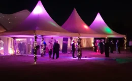 Covered marquee entrance with fairy lights for a winter wedding reception