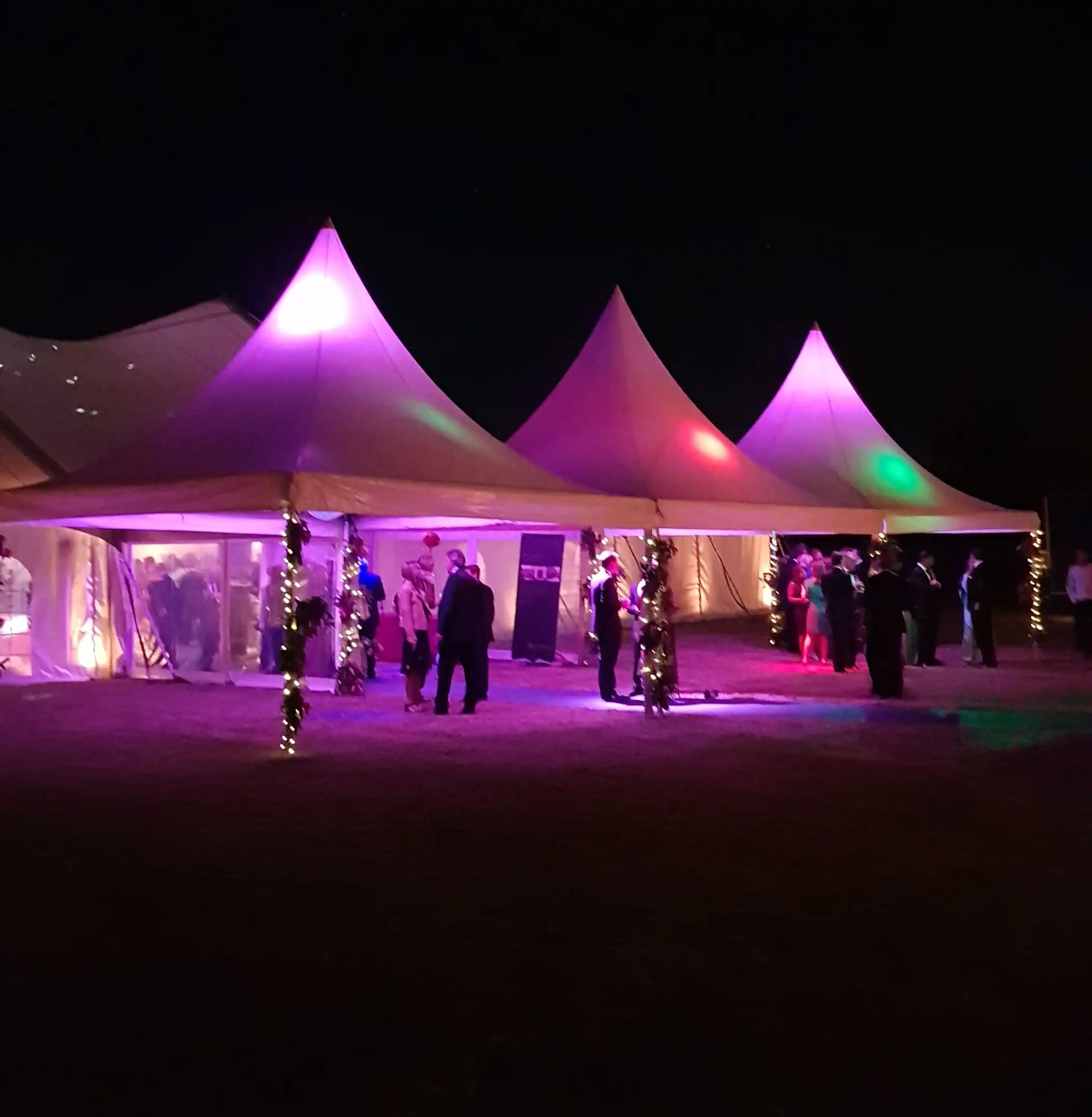 Covered marquee entrance with fairy lights for a winter wedding reception