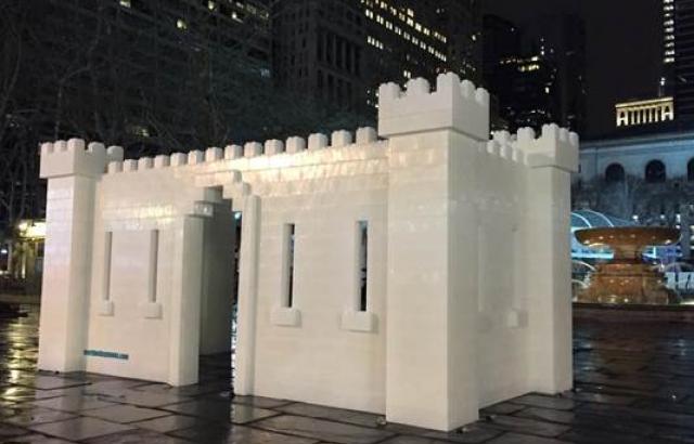 Castle structure built from white EverBlock modular blocks, demonstrating creative temporary construction using interlocking plastic panels.
