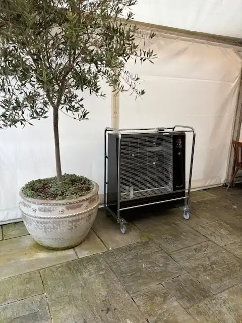 Airrex bio heater inside a marquee providing efficient radiant heating for events and temporary structures