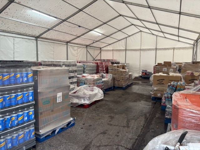 Temporary warehouse marquee providing additional commercial storage space for stock and equipment
